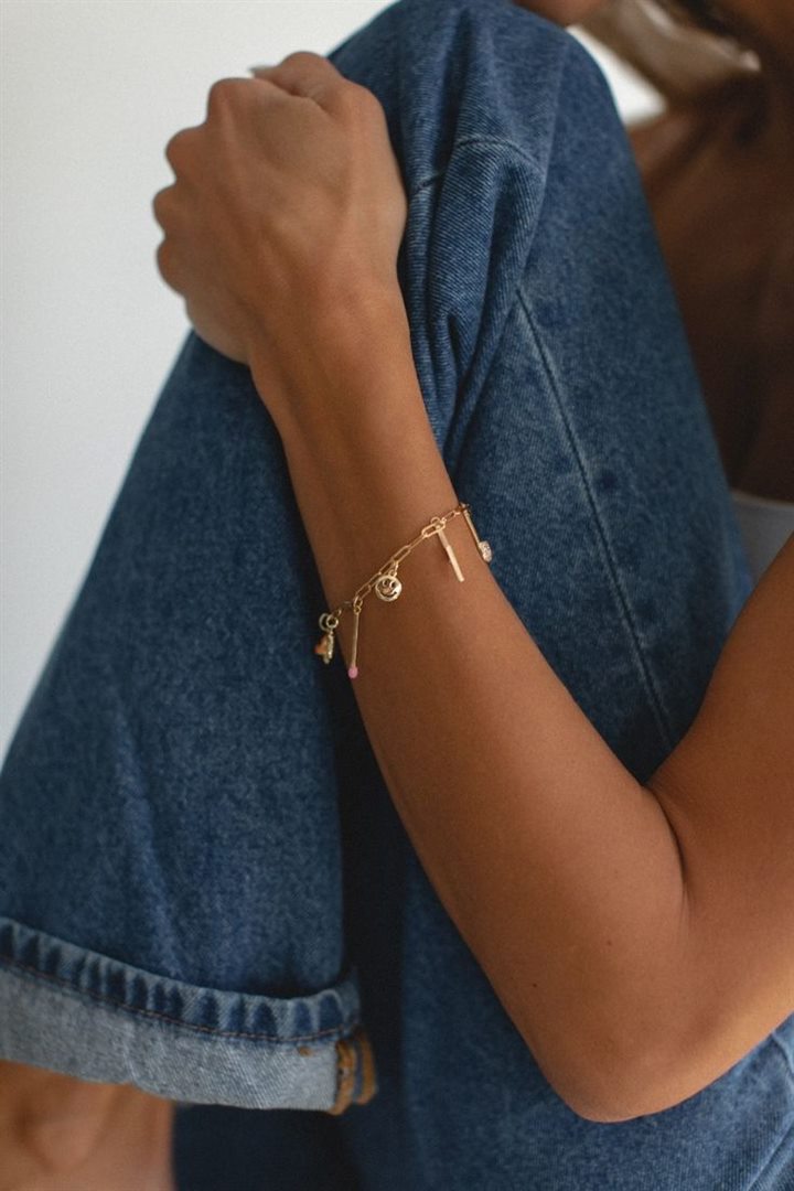 Lifestyle creator showcasing a charm bracelet