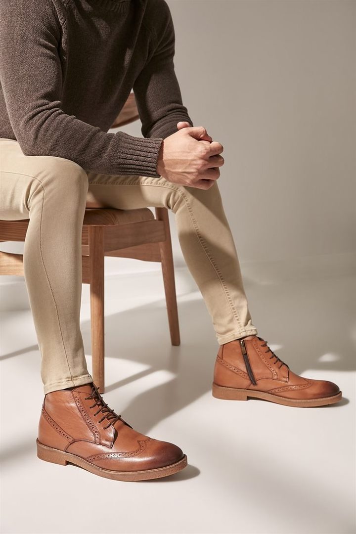 Fashion creator showcasing leather boots